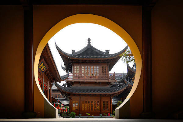 Shanghai building seen through a keyhole arch, by Matt Cashore